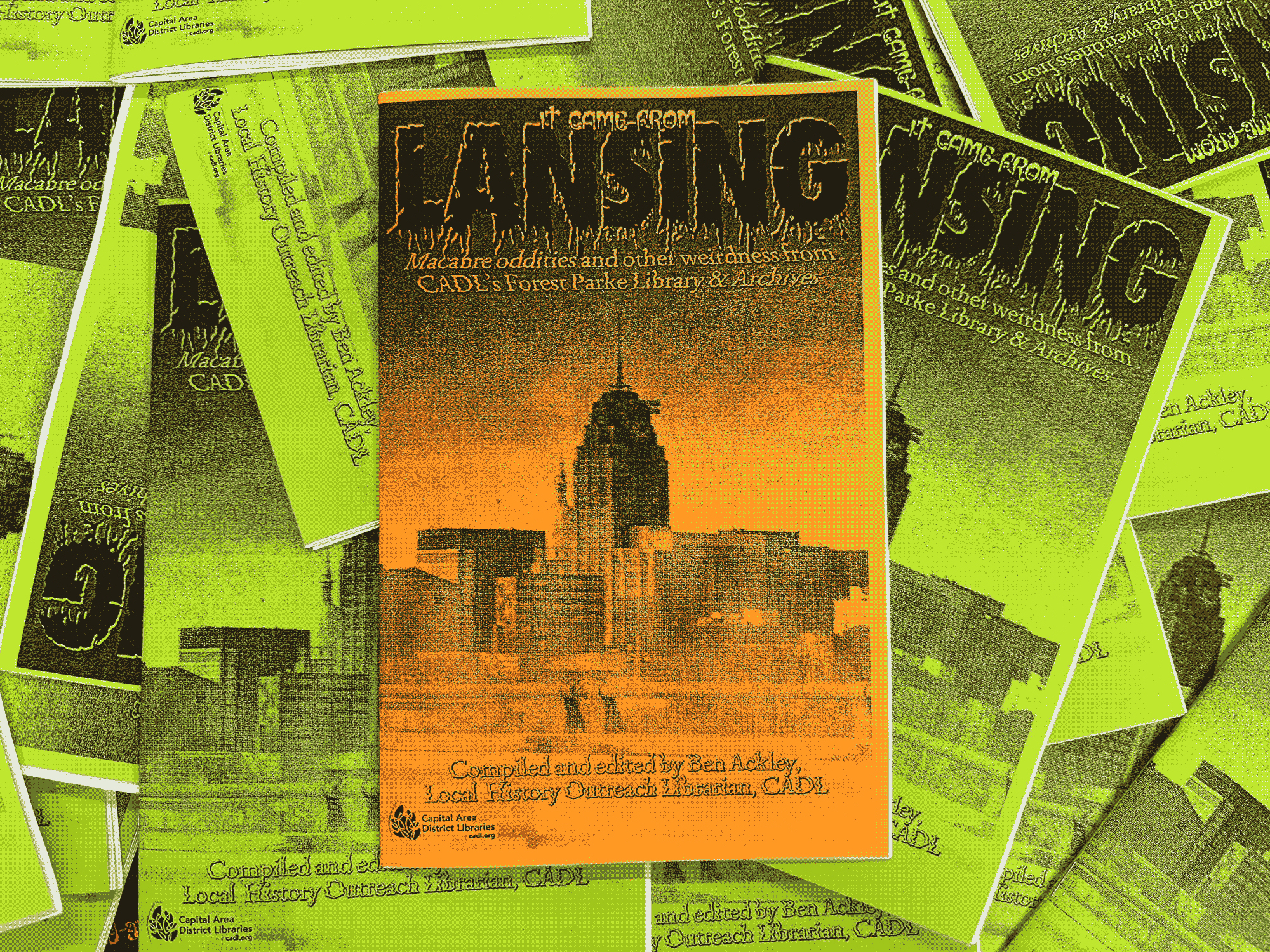 Copies of my second archival zine, 'It Came From Lansing,' spread out atop one another